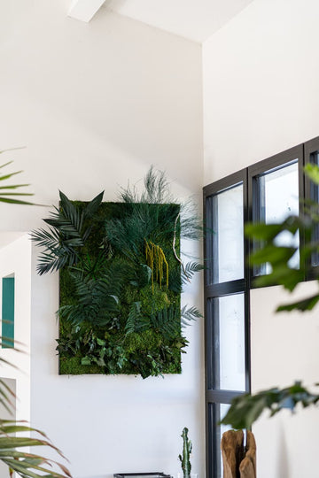 A beautifully crafted moss wall art piece featuring lush green moss arranged in an artistic design. The natural textures and vibrant shades of green create a striking, eco-friendly decor piece that brings a touch of nature indoors.